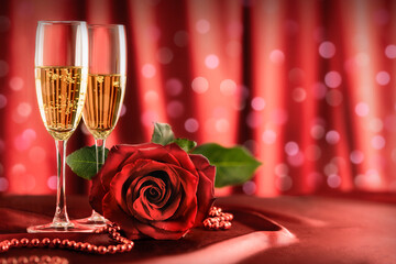 valentine's day, wedding champagne glasses and a red rose flower on the table. festive romantic...