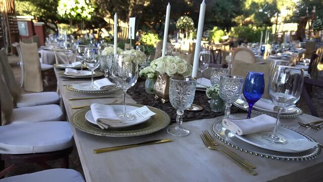 An elegant table set for a wedding, with white and blue elements.