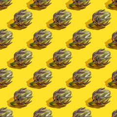 Fototapeta na wymiar Seamless pattern with fresh organic artichoke on yellow background.