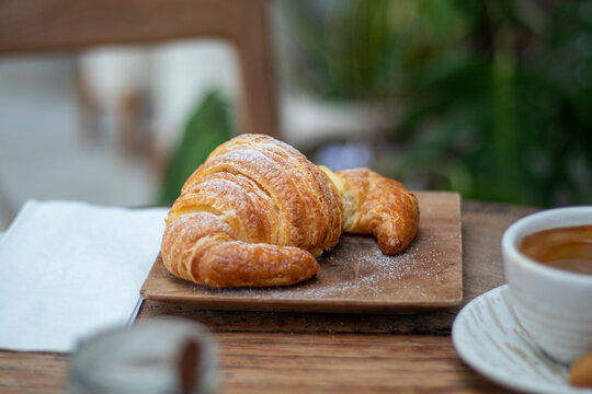 croissant on the wooden table. 