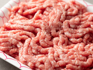 Raw minced meat on a wrapping plate