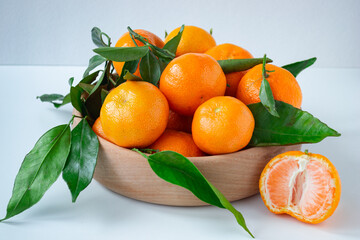 tangerines in a wooden plate