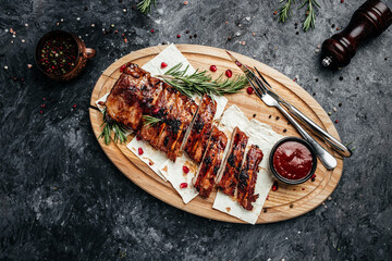 Spicy hot grilled spare ribs, Barbecue Pork Spare Ribs with BBQ sauce, banner, menu, recipe place for text, top view. - obrazy, fototapety, plakaty