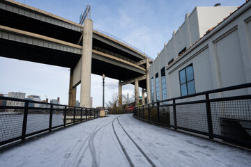 Eastbank Esplanade, a pedestrian and bicycle path along the east shore of the Willamette River in Portland, Oregon, on a cold winter morning after snowfall.