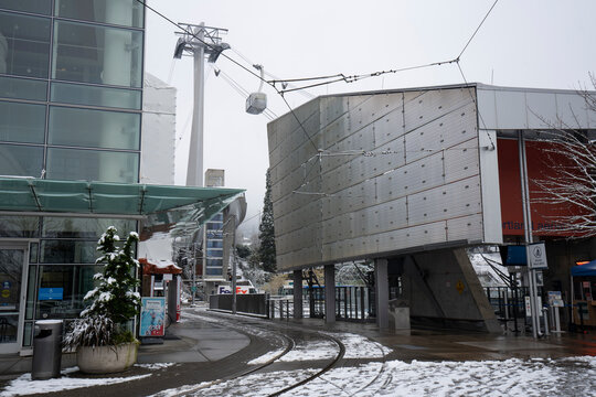 Portland, OR, USA - Dec 28, 2021: A Portland Aerial Tram car travels back to the Lower Terminal at the OHSU South Waterfront campus in southwest Portland, Oregon, on a cold winter day after snowfall.