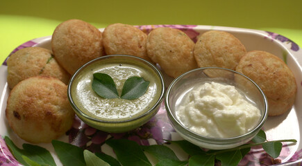 Appum or Appe, Appam or Mixed dal or Rava Appe served with green   chutney. A Ball shape popular south Indian breakfast dish, Selective focus
