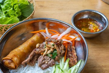 Popular Vietnamese food with rice noodles, grill pork and vegetable