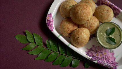 Appum or Appe, Appam or Mixed dal or Rava Appe served with green   chutney. A Ball shape popular south Indian breakfast dish, Selective focus
