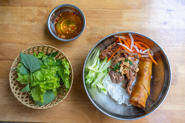 Popular and famous Vietnamese food with rice noodles, grill pork and vegetable