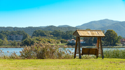 wooden swing on the grass