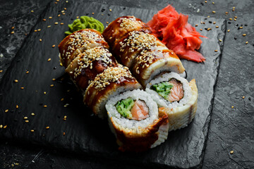 Traditional sushi rolls on a stone plate. Close-up. Sushi menu. Japanese food.