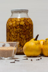 Homemade quince liqueur. Maceration of quinces in water, cane sugar, cinnamon, cloves and alcohol.