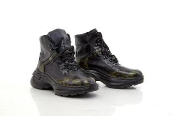 Black women sneakers in the studio on white background. Fashion shooting for a catalog or store indoors