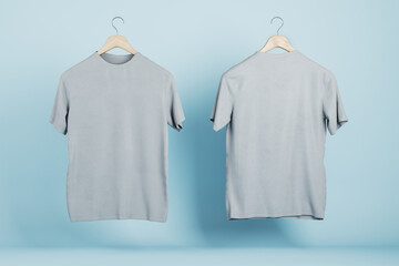 Empty gray t-shirts on blue wall background, Product design and presentation concept. Mock up logo. 3D Rendering.