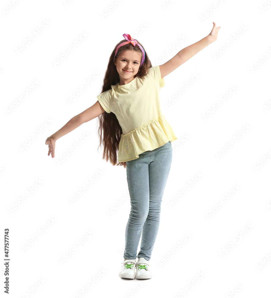 Poster Cute little girl in yellow t-shirt dancing on white background