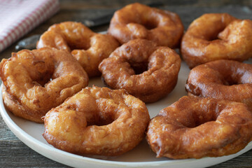 Homemade fresh deep fried cruller on a plate