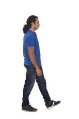 Naklejka premium side view of a man dressed in casual clothes with tattoos on white background