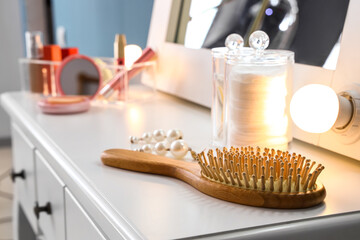 Hair brush on dressing table in room
