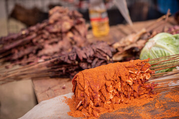 Spiced Suya Meat on display for sale in a market