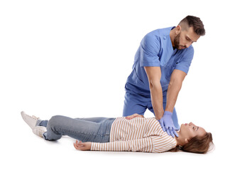 Doctor in uniform performing first aid on unconscious woman against white background