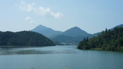 The beautiful lake landscapes surrounded by the green mountains in the countryside of the China