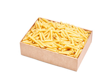 Pile of raw macaroni in a cardboard box on a white background