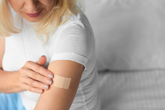 Mature woman with applied nicotine patch at home. Smoking cessation