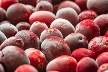 frozen red cranberries background closeup