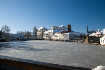 Neuhaus castle in winter. View over the frozen pond Small Vajgar.