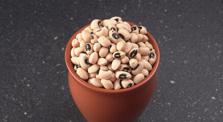 Uncooked black eyed peas. Health food concept.