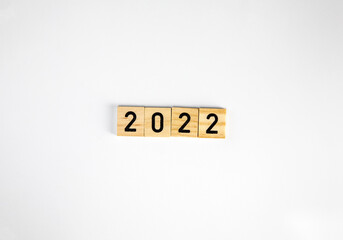 woodblocks cubes with a number 2022 in white isolated background with copy space. image banner size. new year 2022 concept.