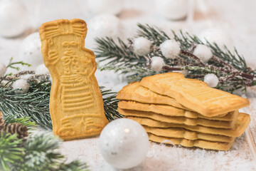 Speculoos biscuits on white background with Christmas decoration. European specialty for Christmas.