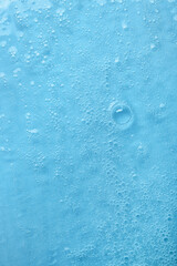 Water with bubbles on blue background