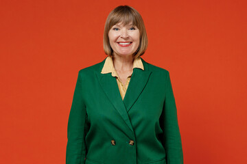 Elderly smiling happy european confident friendly cheerful caucasian woman 50s wearing green...