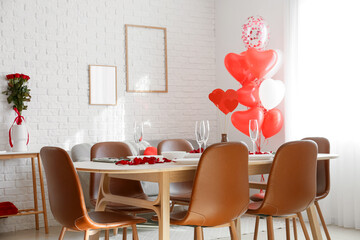 Table with beautiful setting in dining room decorated for Valentine's day