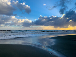 Amazing sky reflection at the sea coast, sand beach, evening time, natural background