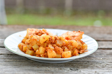  Potato and minced meat  Casserole  with   parmesan cheese and garlic on wooden rustic bakcground.  Bulgarian moussaka