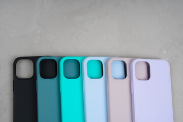 Cases set for smartphone on grey background. Silicone protection for mobile phone. Colorful silicone phone cases.