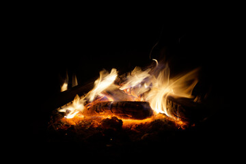 Fototapeta na wymiar Bright campfire made of wood