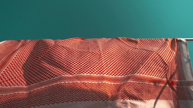 The Saudi shemagh flutters