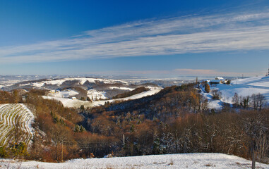 Winter,sunny landscape with South Styrian vineyards, known as Austrian Tuscany, a charming region on the border between Austria and Slovenia with rolling hills, picturesque villages and wine taverns.