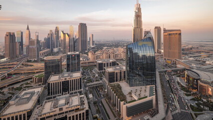 Fototapeta na wymiar Futuristic Dubai Downtown and finansial district skyline aerial day to night timelapse.