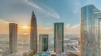 Sky view to skyscrapers during sunset in Dubai downtown aerial timelapse.
