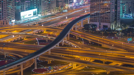 Fototapeta na wymiar Highway intersection and overpass of Dubai downtown aerial night timelapse.