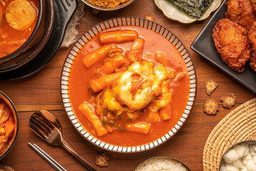Spicy Rice Cake with Cheese or Teokbokki with spicy sauce Korean traditional food, Tteokbokki is Korean rice cake stick in spicy sauce Korean cuisine dish.