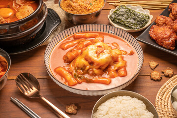 Spicy Rice Cake with Cheese or Teokbokki with spicy sauce Korean traditional food, Tteokbokki is Korean rice cake stick in spicy sauce Korean cuisine dish.