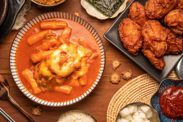 Spicy Rice Cake with Cheese or Teokbokki with spicy sauce Korean traditional food, Tteokbokki is Korean rice cake stick in spicy sauce Korean cuisine dish.