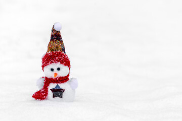 Merry christmas and happy new year greeting card with copy space Happy two little snowmen in red, blue cap and scarf standing in winter snow background Xmas fairytale Hello January, February concept