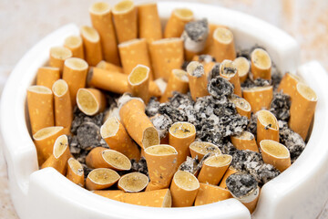 close up of cigarettes and ashtray