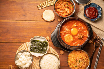 Kimchi stew or Kimchi soup, Korea’s national dish spicy soup with vegetable, meat, eggs, tofu served in a hot pot. Kimchi Jjigae korean trditional food.